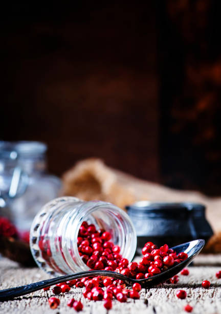 istock Pink pepper in spoon and jar 964454392