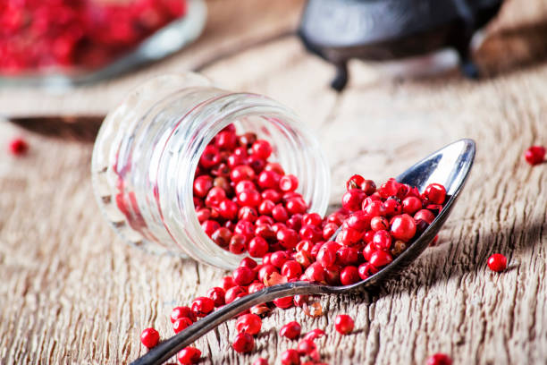 istock Pink pepper in spoon and jar 964459044