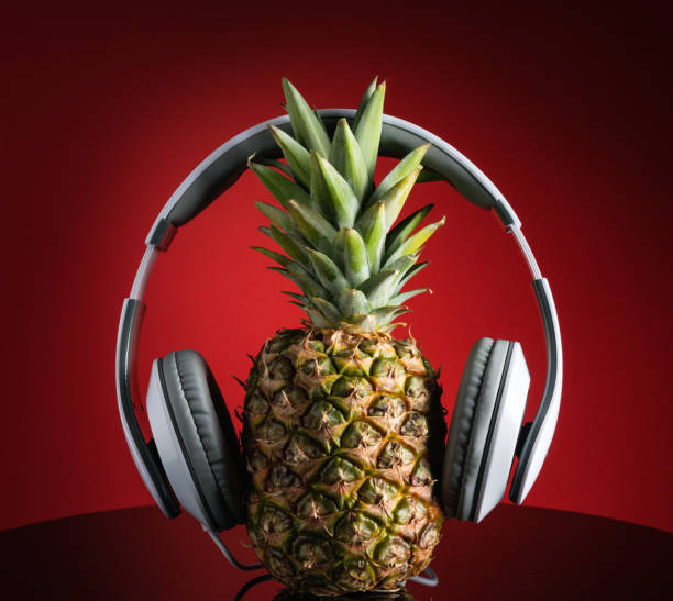 istock Music concept, headphones and pineapple DJ 964461352