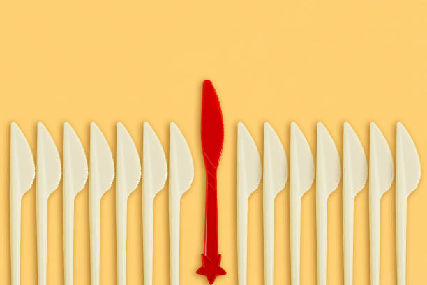 istock Creative leadership concept: red knife among white 964474684