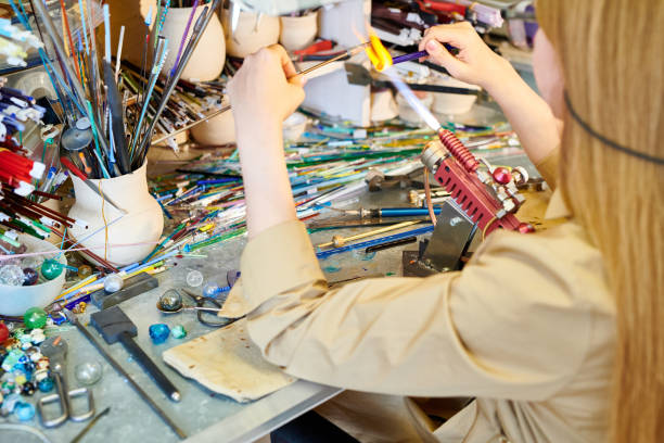 istock Unrecognizable Female Artist Melting Glass 964483330