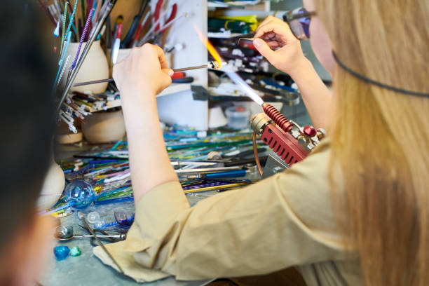 istock Female Artist Shaping Glass 964483386