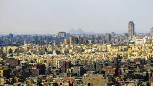 View of the City of Cairo, Egypt, where you can see in the background the 3 pyramids of Cheops, Khafre and Micerinos. Made from the Alabaster Mosque, in the Citadel of Saladin.