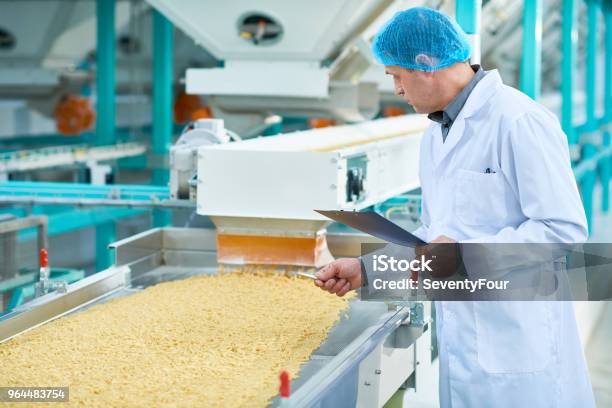 Senior Man At Macaroni Line Stock Photo - Download Image Now - Food, Manufacturing, Factory