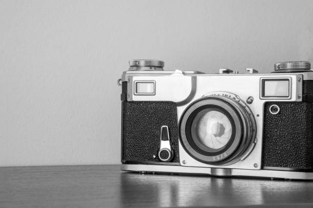istock classic camera on the shelf on the wall background 964490560