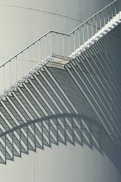 istock Stairs and shadow on oil storge tank 96452028