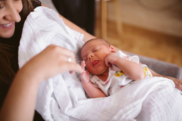 istock Happy young mother holding newborn baby 964522732