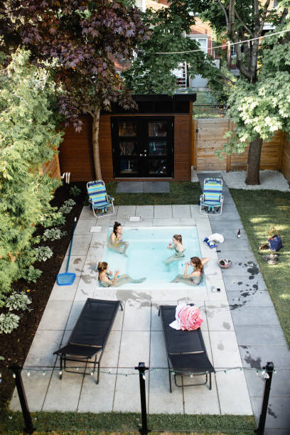 istock Young woman at a pool party 964576670