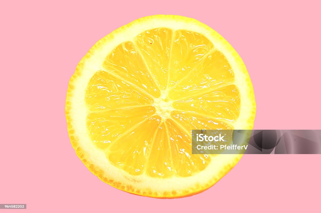 Slice of Lemon Slice of lemon on pink in minimal style Lemonade Stock Photo