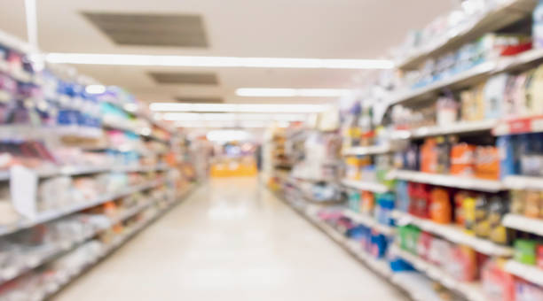 istock supermarket aisle with product on shelves blurred background 964582314