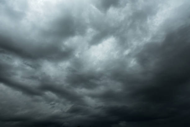 istock Dark sky and black clouds, Dramatic storm clouds before rainy, Closeup black cloud motion 964582360