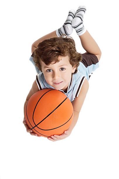 istock adorable boy playing the basketball 96458669