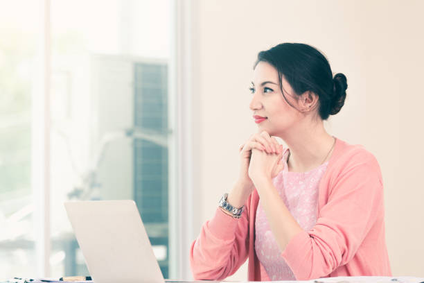 istock attractive businesswoman sitting working 964608378