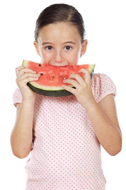 istock adorable girl eating watermelon 96463466