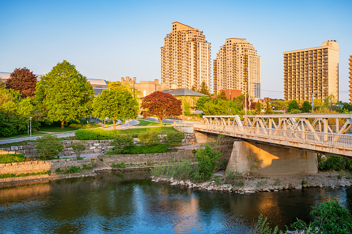 Stock photograph of new condos and the Thames River in downtown London Ontario Canada on a sunny day.