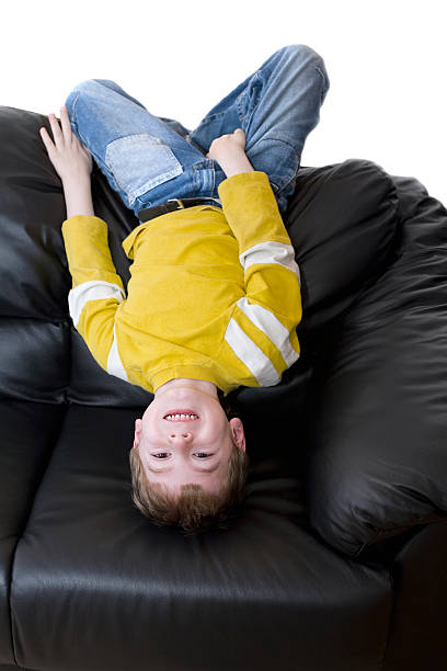 istock Boy  lies on the couch 96464673