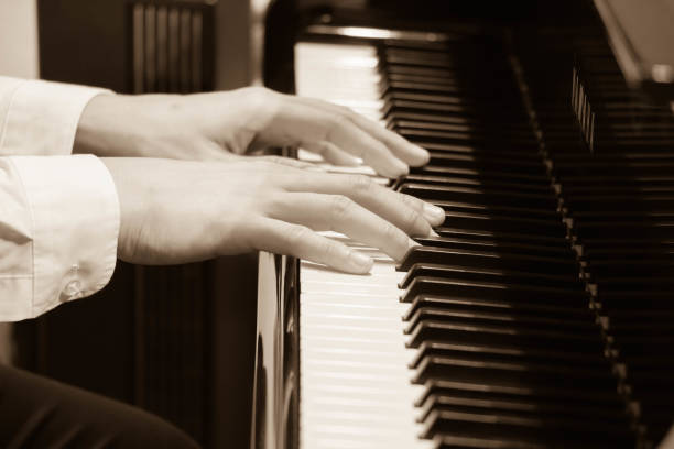 istock hand of musician playing piano 964664758