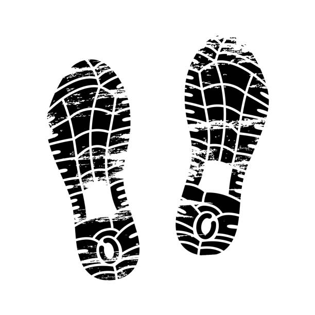 Footprints and shoeprints icon in black and white showing bare feet and the imprint of the soles with patterns of male and female footwear. Shoes boots imprint Footprints and shoeprints icon in black and white showing bare feet and the imprint of the soles with patterns of male and female footwear. Shoes boots imprint. high heel footprint stock illustrations