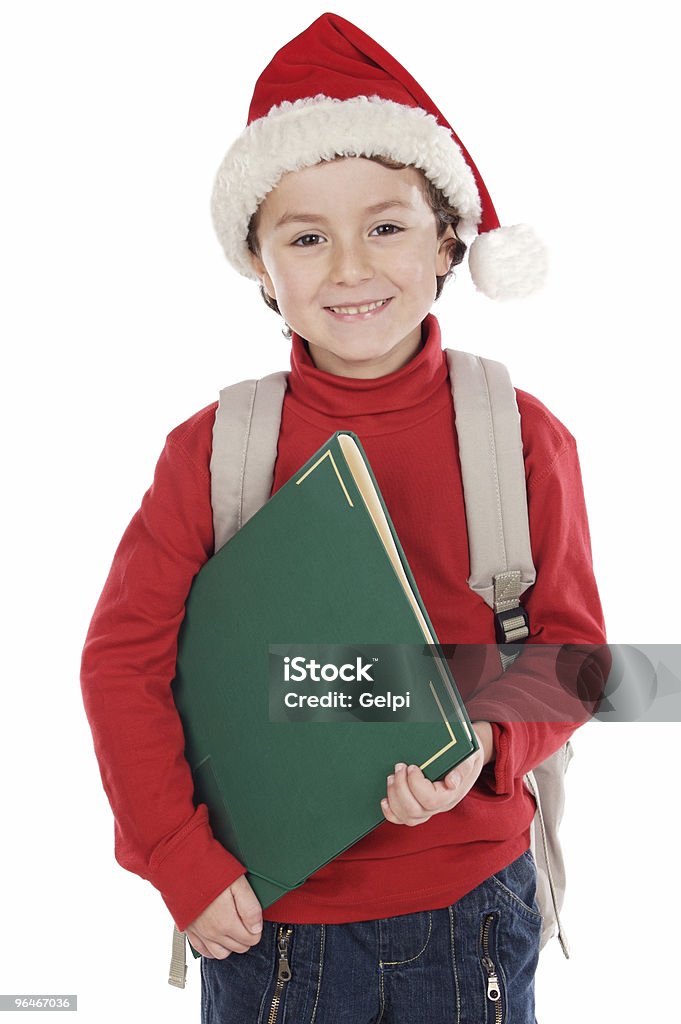 Criança com chapéu de Papai Noel estudar - Foto de stock de Educação royalty-free