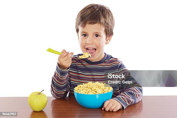 Young Child Eating A Massive Bowl Of Breakfast Cereal Stock Photo - Download Image Now