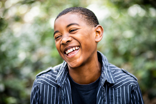 Portrait of a young black boy smiling
