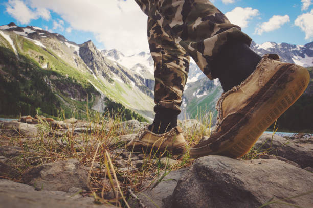 istock Close up on shoes on mountains trail. 964691888