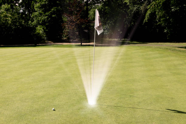 istock Bright Light Shining out of Golf Hole 964719498