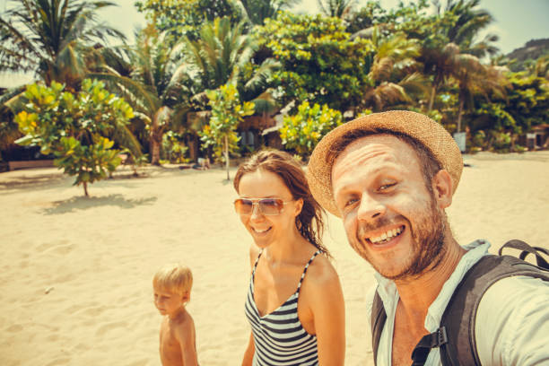 istock Family sitting at the beach 964719562