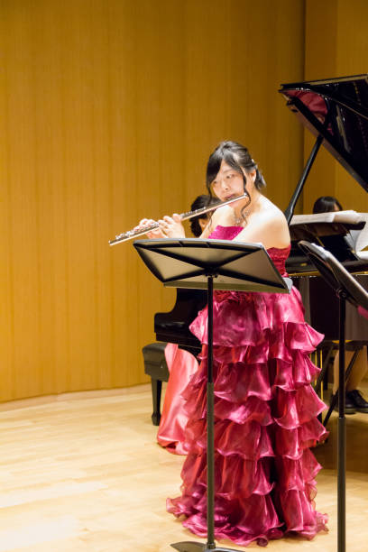 istock Woman Playing Flute in a Concert 964722782