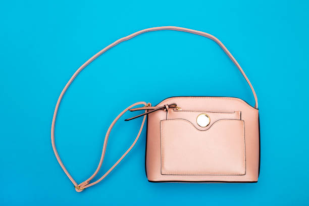 istock Pink Women's handbag on a blue background 964736154