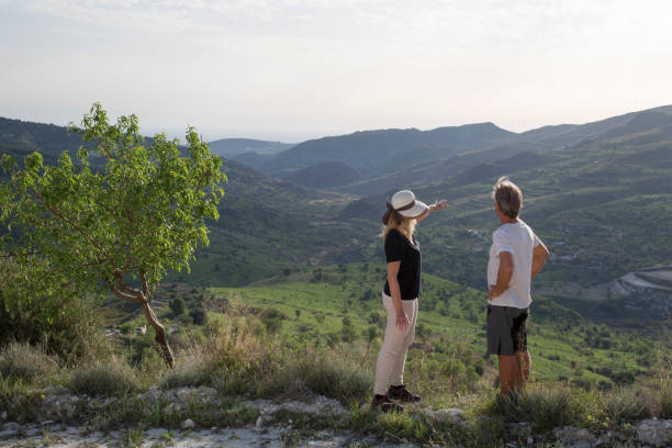 istock Mature couple hiking in hills, spring 964736562