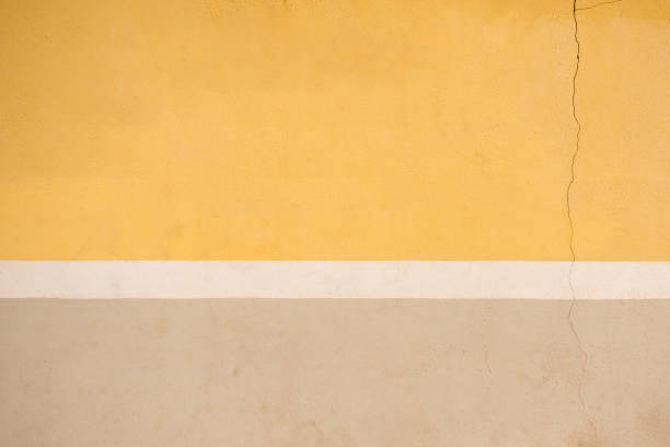istock Painted yellow, white and beige wall background 964736700