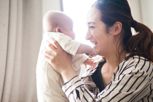 istock Mother looking at the baby's face. 964741746
