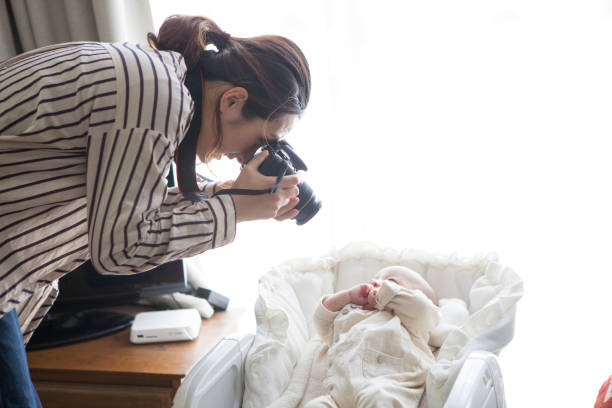 istock Mother taking pictures of babies. 964741890
