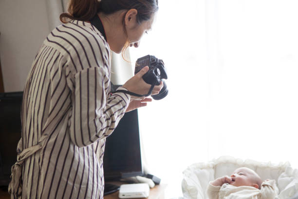 istock Mother taking pictures of babies. 964741936