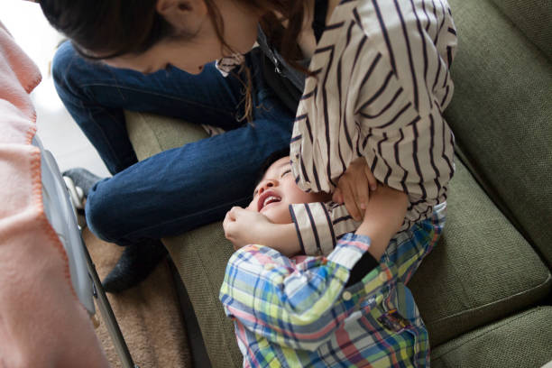 istock Children and mothers playing on the sofa. 964742342