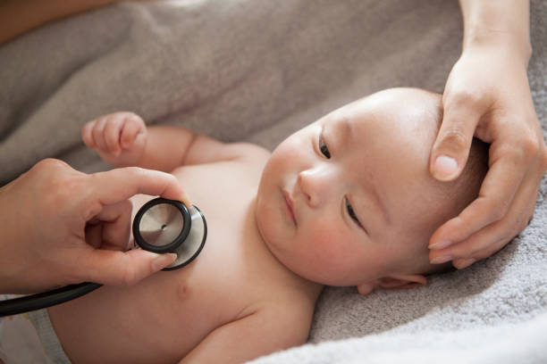 istock A baby being heard heart sounds in a stethoscope. 964743210