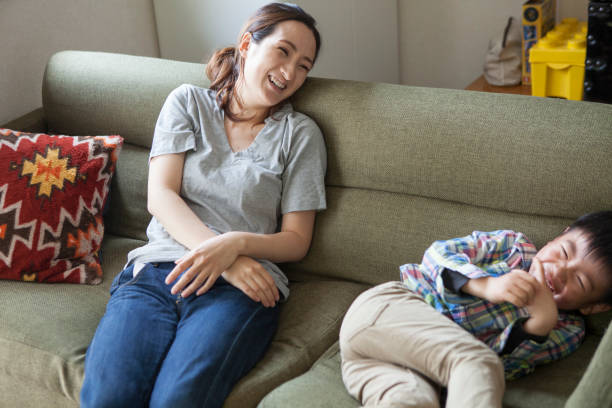 istock Children and mothers playing on the sofa. 964745658