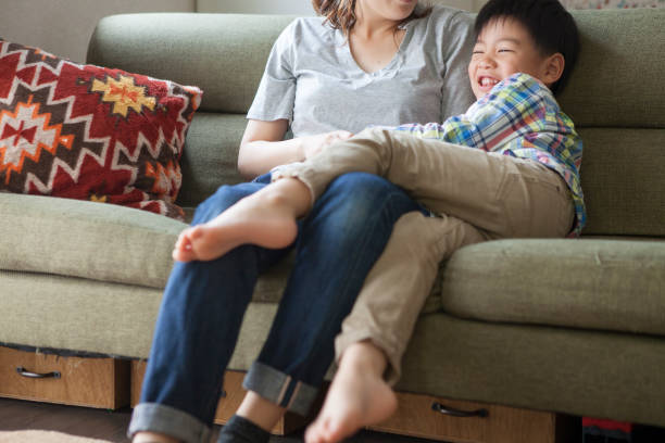 istock Children and mothers playing on the sofa. 964745692