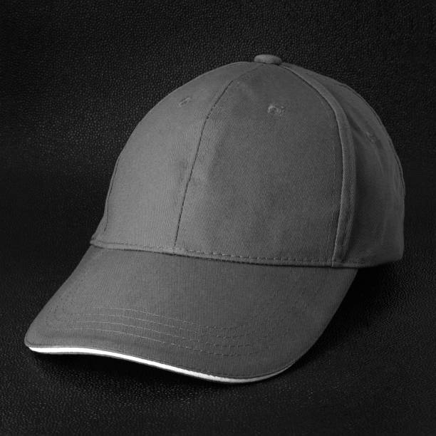 istock Grey cap on dark background. Template of baseball cap in side view. 964746462