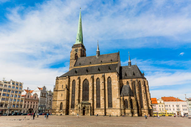 St. Bartholomew's Cathedral in the main square of Plzen with blue sky and clouds in sunny day. Czech Republic, Pilsen. Famous landmark in Czech Republic, Bohemia. St. Bartholomew's Cathedral in the main square of Plzen with blue sky and clouds in sunny day. Czech Republic, Pilsen. Famous landmark in Czech Republic, Bohemia pilsen stock pictures, royalty-free photos & images