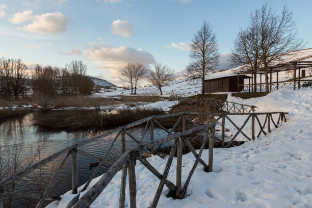 istock Colfiorito (Umbria) lake in winter, with snow all around, trees 964754378