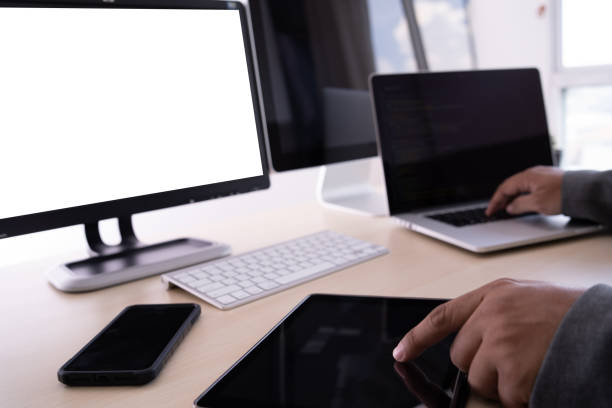 istock Laptop with blank screen on table. Workspace background new project on laptop computer with blank copy space screen for your advertising text message 964754660