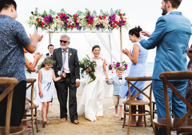 istock Senior couple getting married at the beach 964755240