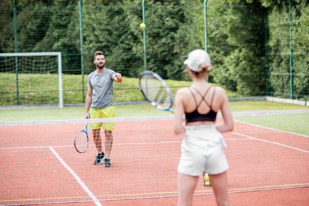 istock Couple playing tennis 964755370
