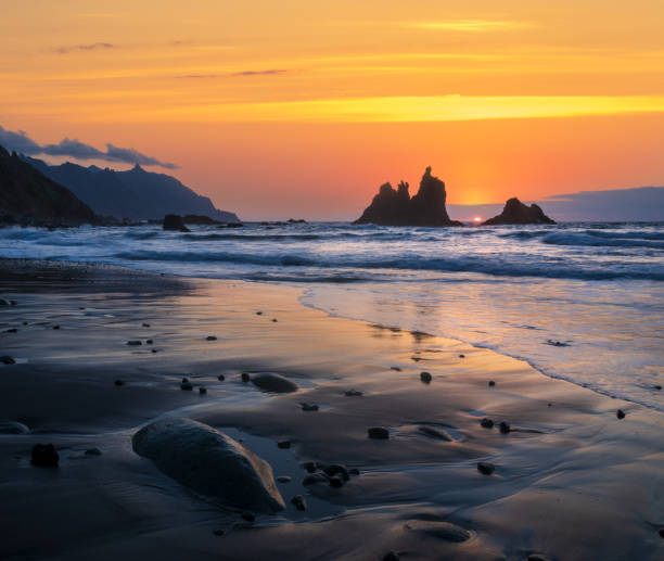 romantic and at the same time dramatic sunset on Benijo beach in tenerife
