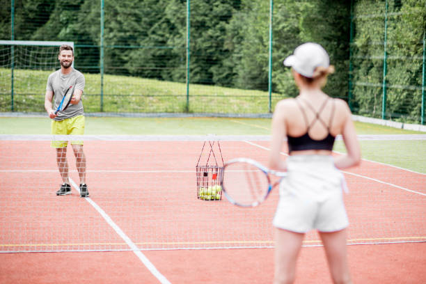 istock Couple playing tennis 964755468