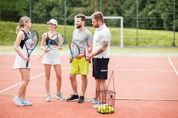 istock Friends on the tennis court 964758024