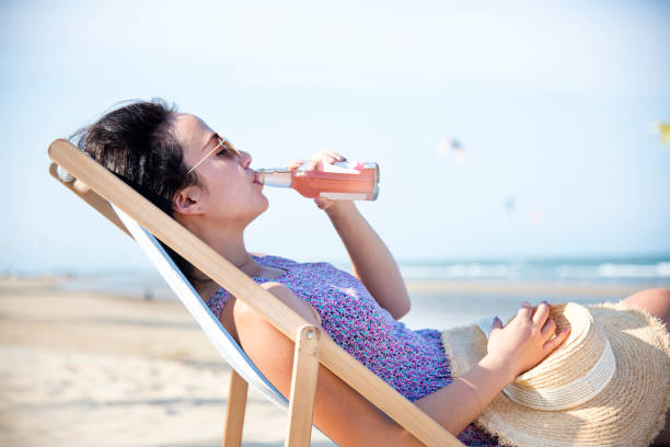istock Woman chilling on the beach 964758506
