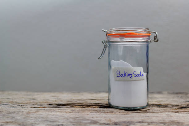 istock baking soda on the wooden table. 964758726